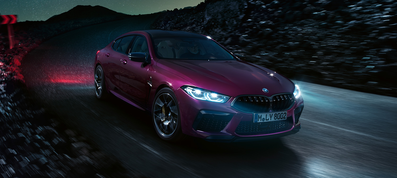 BMW M8 Competition Gran Coupé F93 2020 BMW Individual Ametrine metallic driving at night three-quarter front view